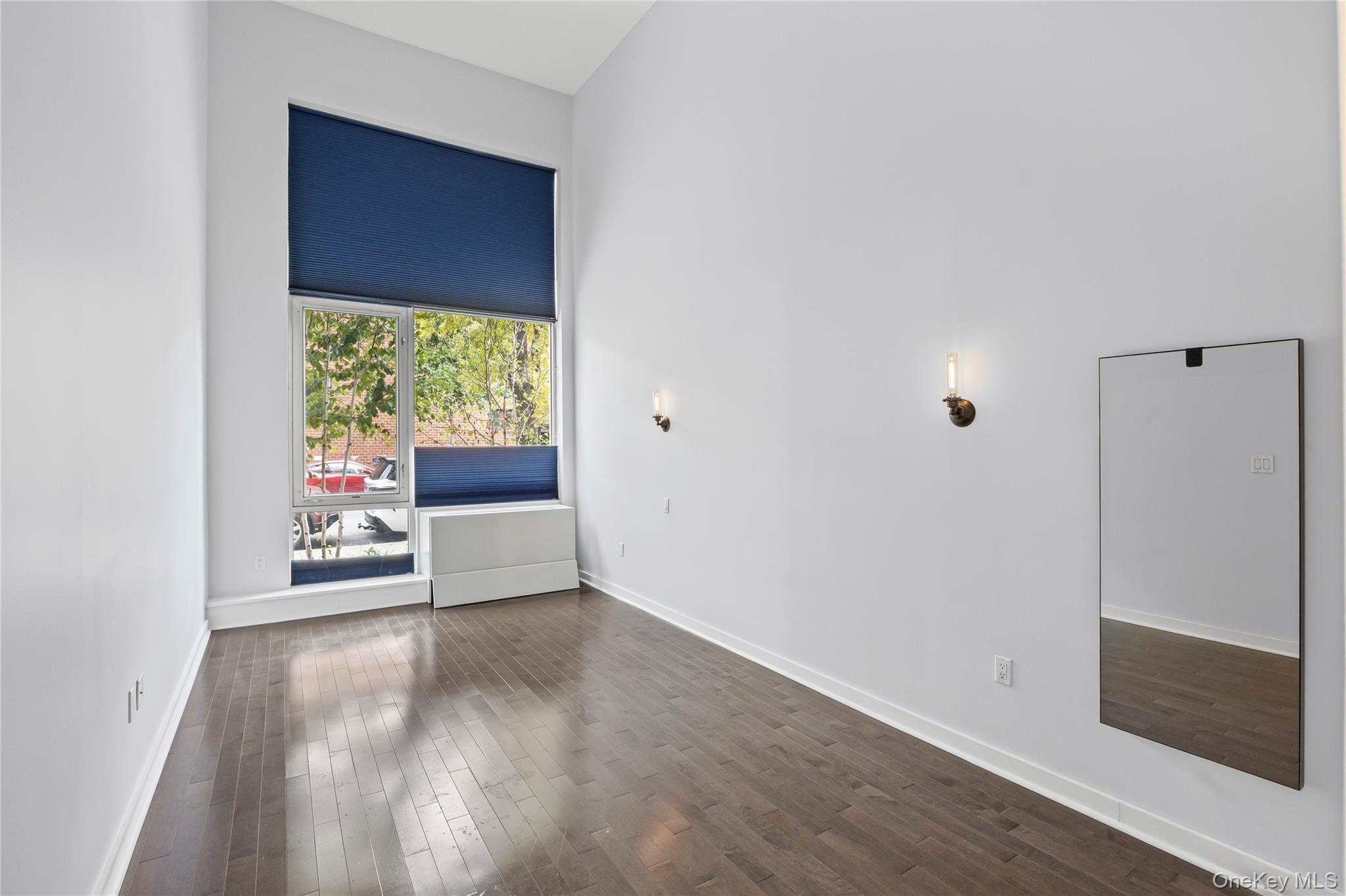 240 51st Avenue, Unit 1H Queens, NY 11101 - Photo 28 of 39 a view of an empty room with glass door
