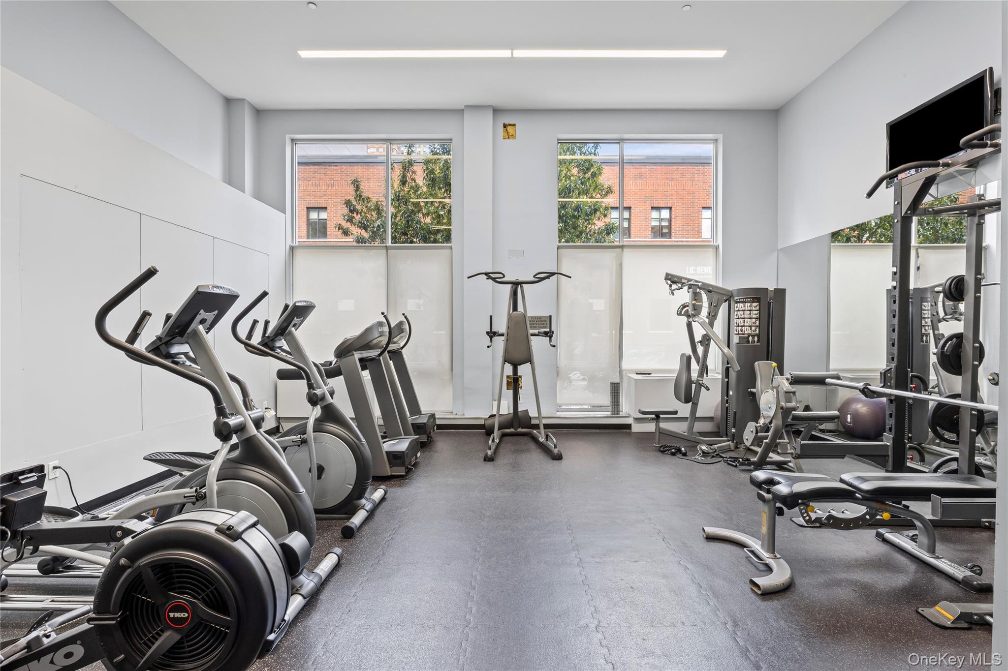 240 51st Avenue, Unit 1H Queens, NY 11101 - Photo 32 of 39 a view of a room with gym equipment