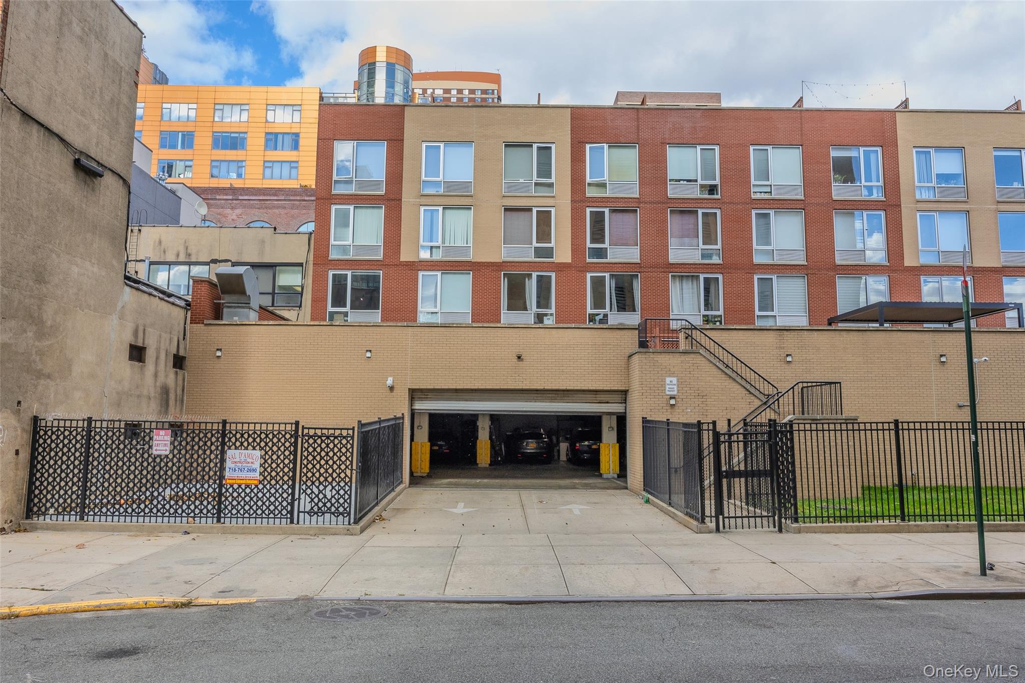 240 51st Avenue, Unit 1H Queens, NY 11101 - Photo 38 of 39 a front view of a building with glass windows