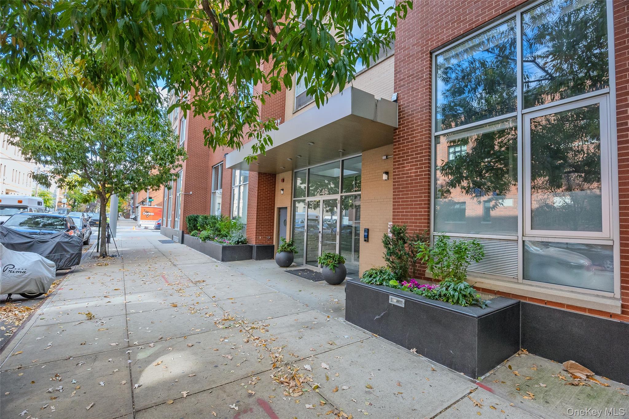 240 51st Avenue, Unit 1H Queens, NY 11101 - Photo 7 of 39 a view of a potted plants on a sidewalk