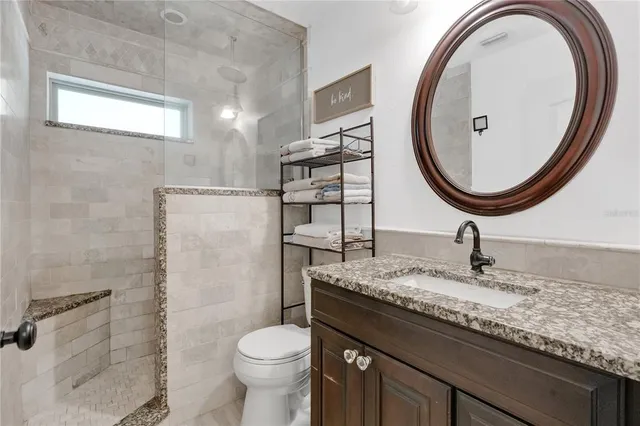 a view of a field with trees in the background