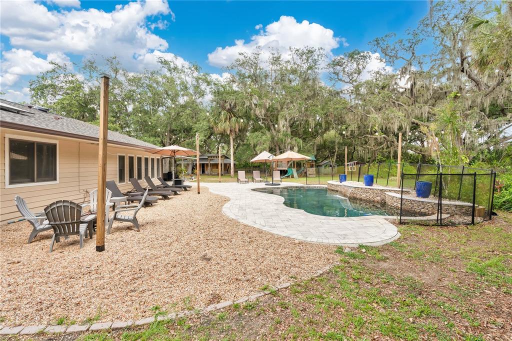 4410 Mildred Bass Road St. Cloud, FL 34772 - Photo 2 of 42 a view of a house with backyard and sitting area