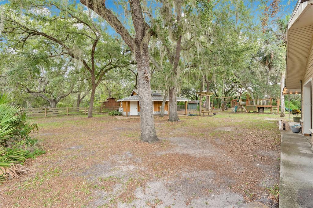 4410 Mildred Bass Road St. Cloud, FL 34772 - Photo 25 of 42 a view of road with large trees