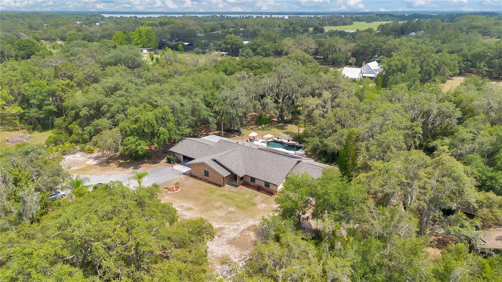 4410 Mildred Bass Road St. Cloud, FL 34772 - Photo 36 of 42 an aerial view of a house with a yard