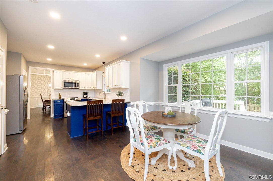 15725 Fox Marsh Drive Moseley, VA 23120 - Photo 20 of 50 a dining room with furniture window and wooden floor