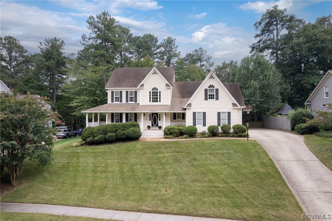 15725 Fox Marsh Drive Moseley, VA 23120 - Photo 2 of 50 a front view of a house with garden