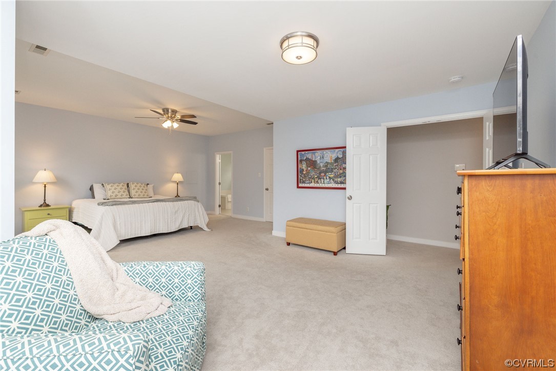 15725 Fox Marsh Drive Moseley, VA 23120 - Photo 32 of 50 a spacious bedroom with a bed and a couch
