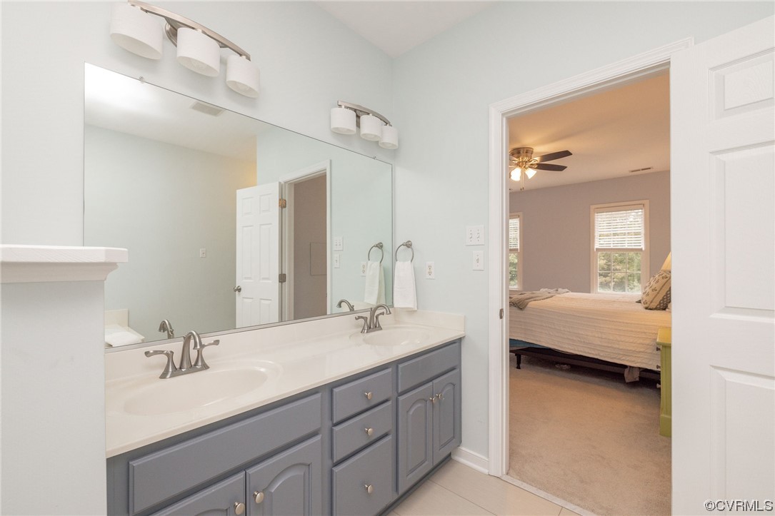 15725 Fox Marsh Drive Moseley, VA 23120 - Photo 35 of 50 a en suite bathroom with a double vanity sink and a mirror