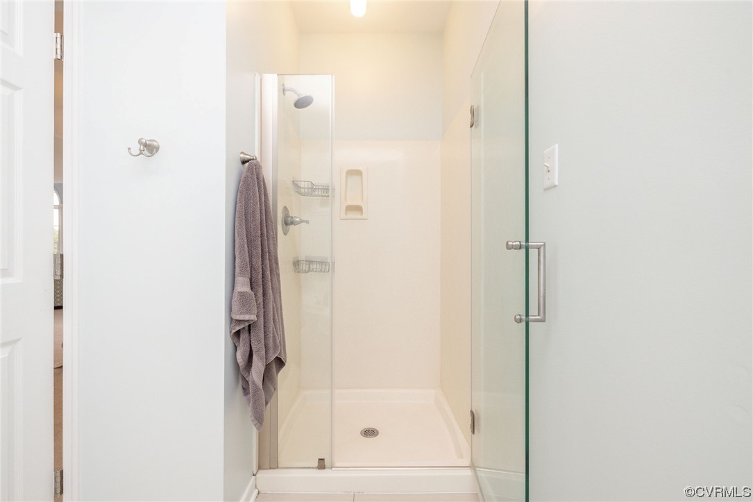 15725 Fox Marsh Drive Moseley, VA 23120 - Photo 37 of 50 a bathroom with a glass shower door