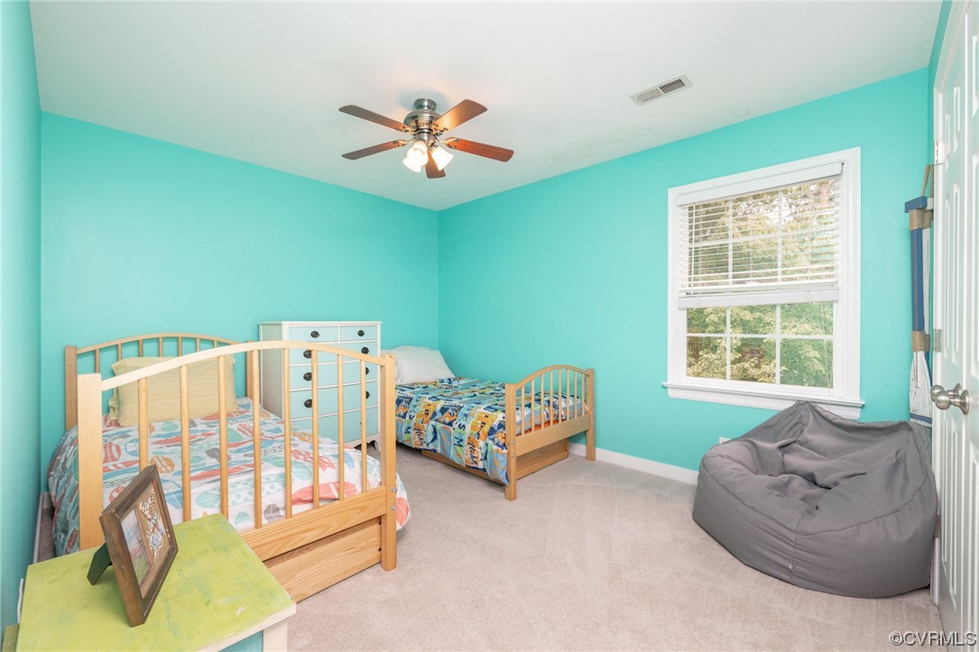 15725 Fox Marsh Drive Moseley, VA 23120 - Photo 38 of 50 a bedroom with a bed and a couch