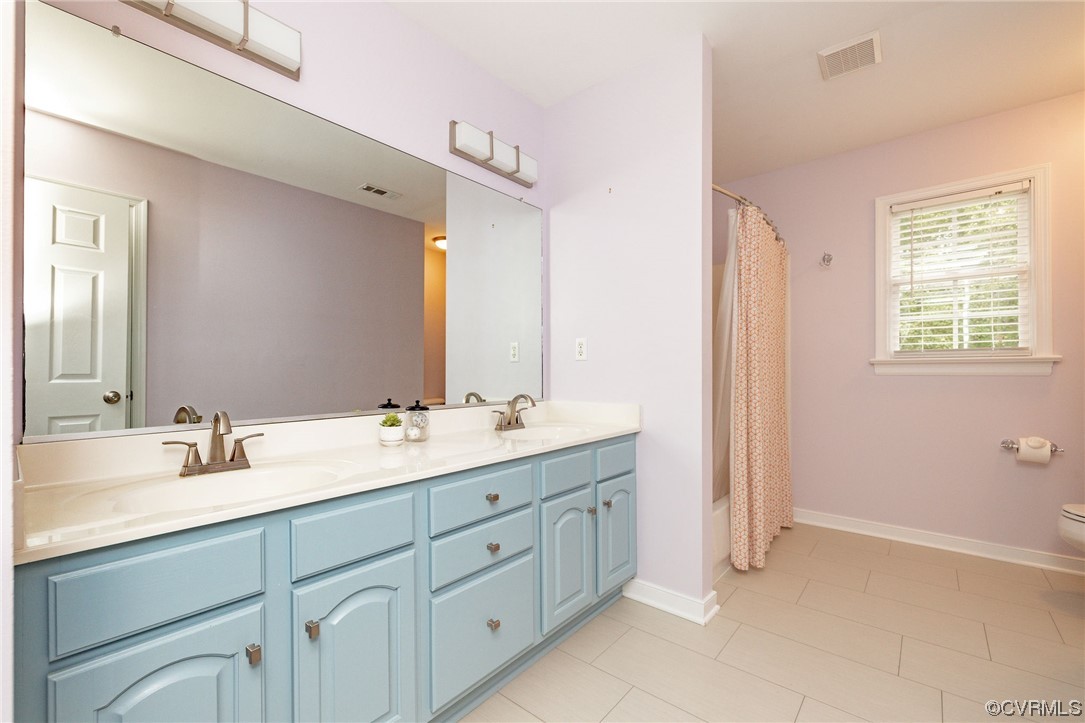 15725 Fox Marsh Drive Moseley, VA 23120 - Photo 39 of 50 a bathroom with double sink and a mirror
