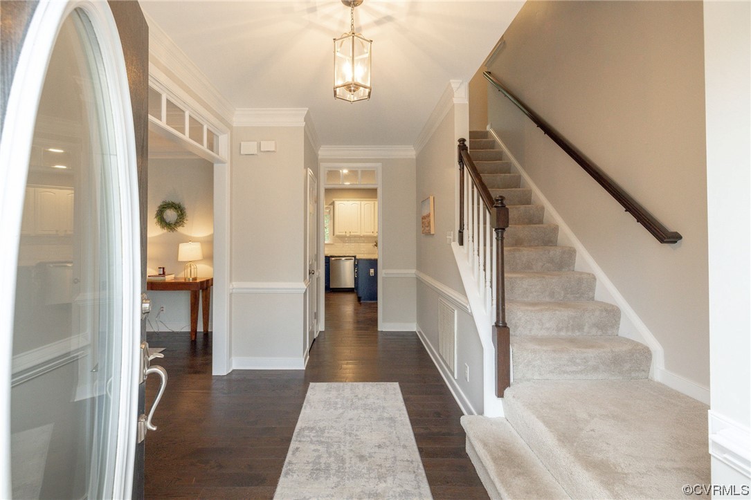 15725 Fox Marsh Drive Moseley, VA 23120 - Photo 6 of 50 a view of a hallway with wooden floor and staircase