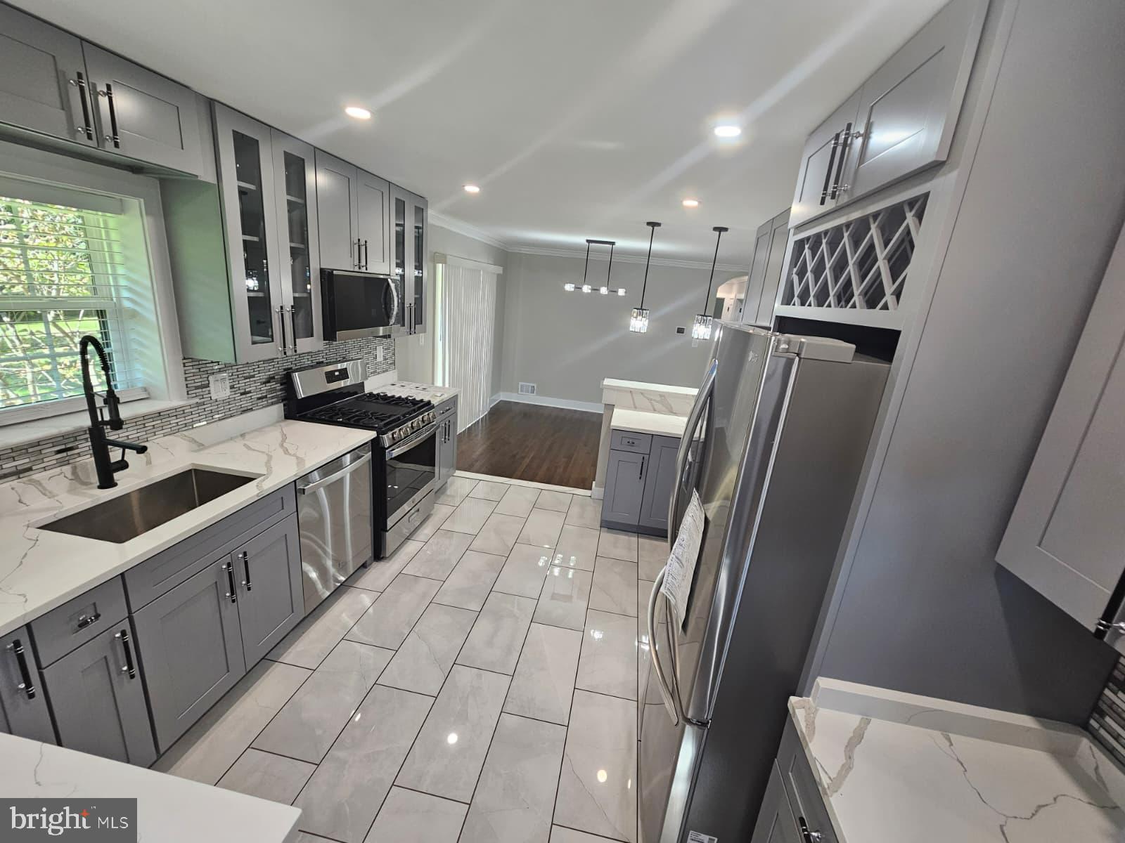 2909 Chapelview Drive Silver Spring, MD 20904 - Photo 13 of 39 a kitchen with stainless steel appliances a refrigerator sink and microwave