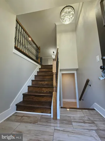 a view of entryway with stairs and wooden floor