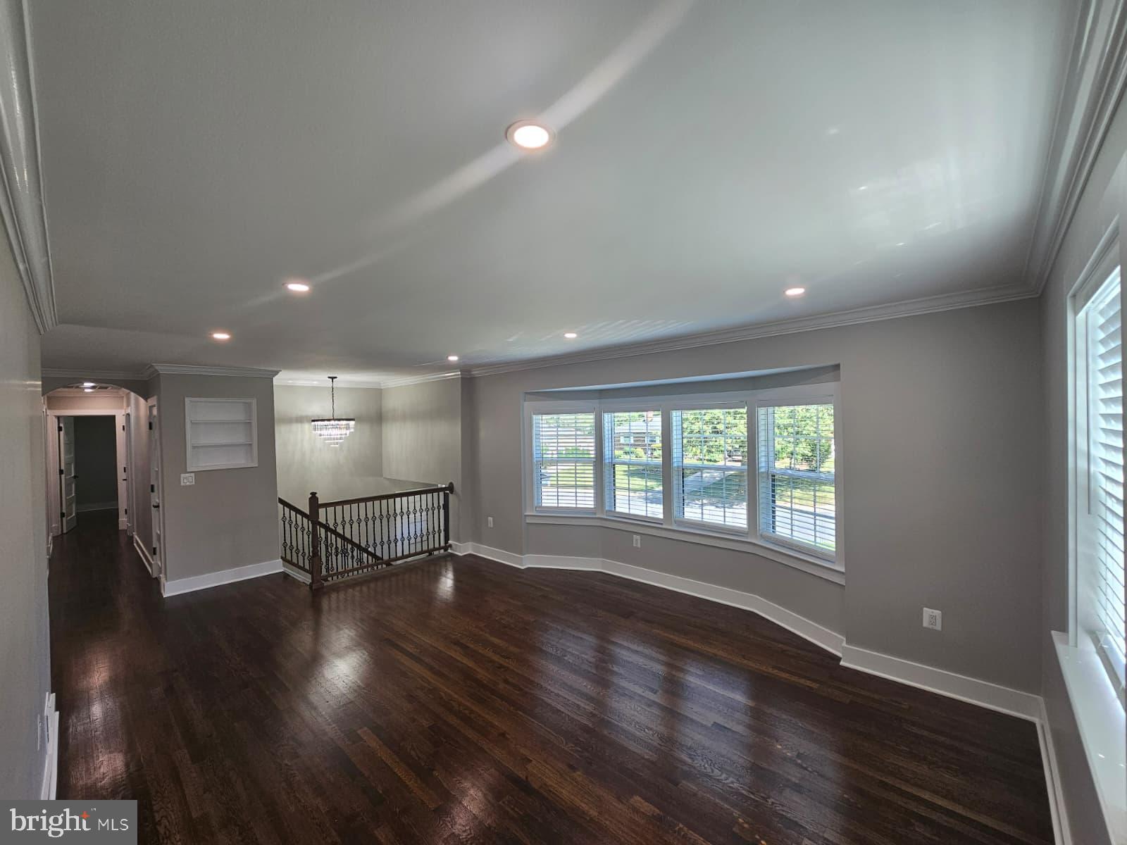 2909 Chapelview Drive Silver Spring, MD 20904 - Photo 6 of 39 an empty room with wooden floor and windows