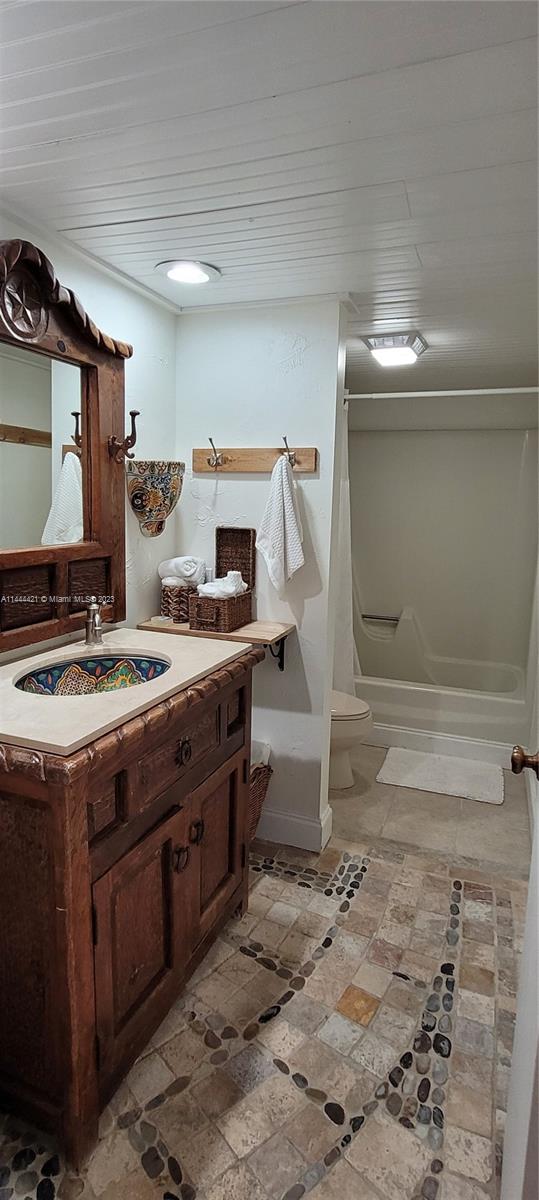 825 Center Street, Unit 28C Jupiter, FL 33458 - Photo 12 of 29 a kitchen that has a stove and a wooden cabinets