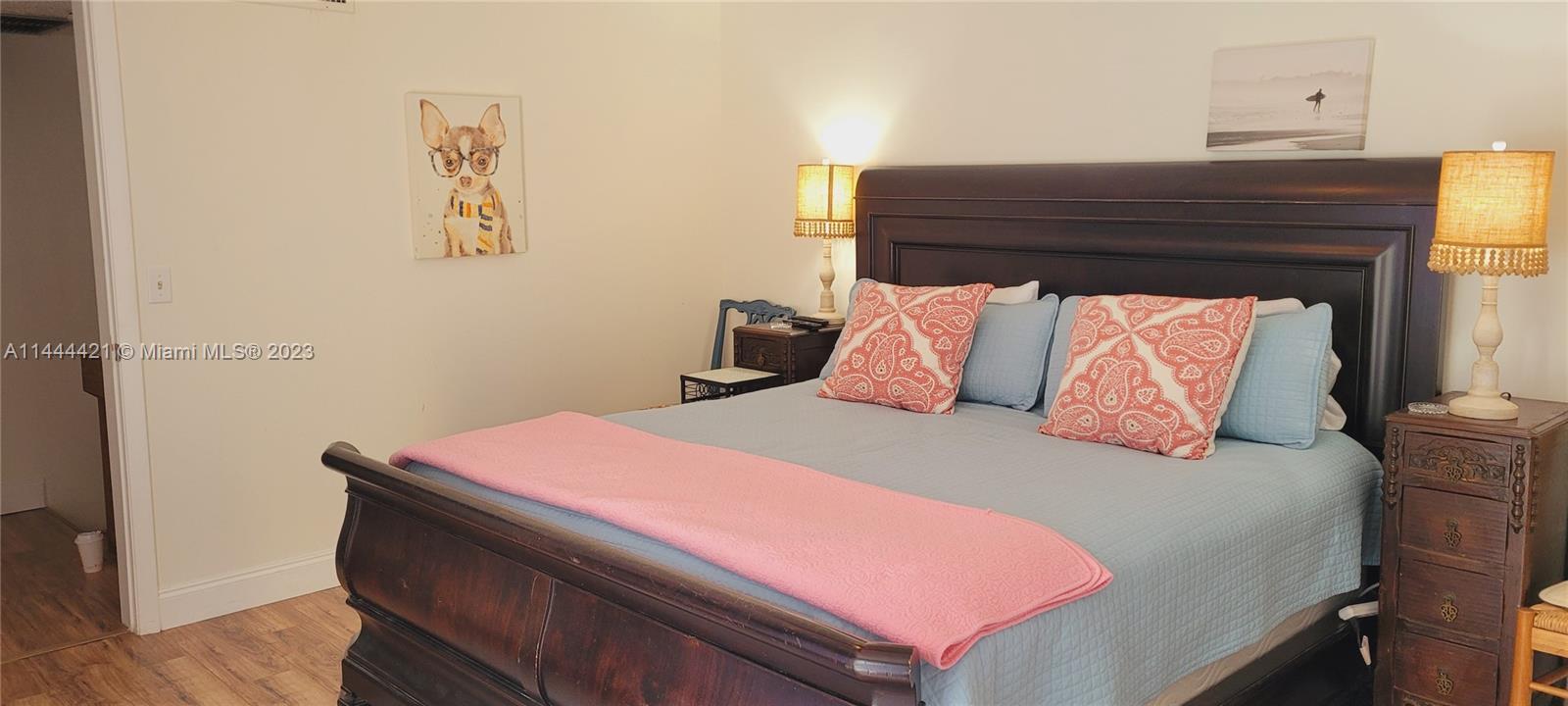 825 Center Street, Unit 28C Jupiter, FL 33458 - Photo 13 of 29 a room with a bed and a table
