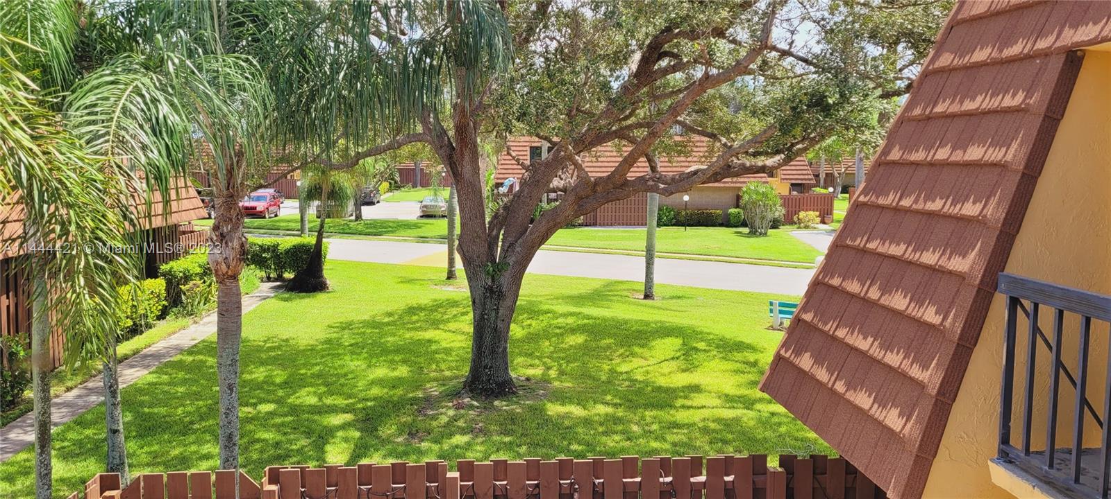 825 Center Street, Unit 28C Jupiter, FL 33458 - Photo 16 of 29 a view of a yard with a tree