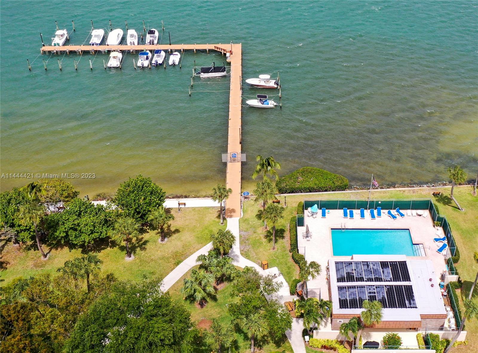825 Center Street, Unit 28C Jupiter, FL 33458 - Photo 3 of 29 a balcony with table and chairs and a yard