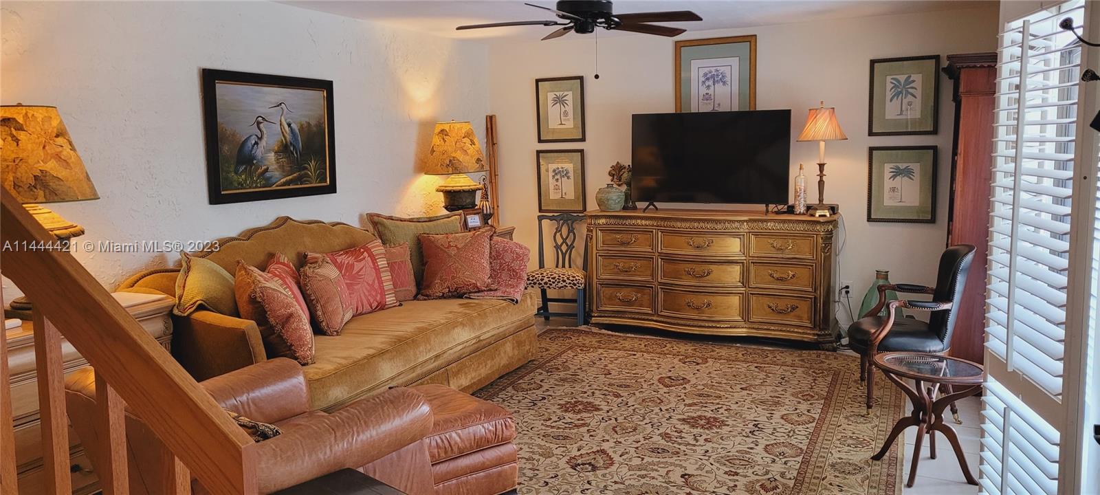 825 Center Street, Unit 28C Jupiter, FL 33458 - Photo 8 of 29 a living room with furniture and a flat screen tv
