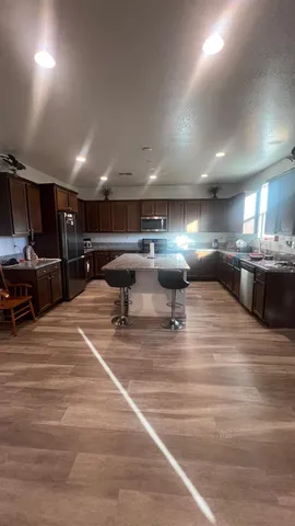 a room with lots of furniture and a kitchen