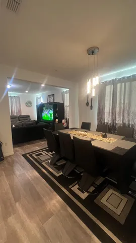 a room with gym equipment and a view of living room