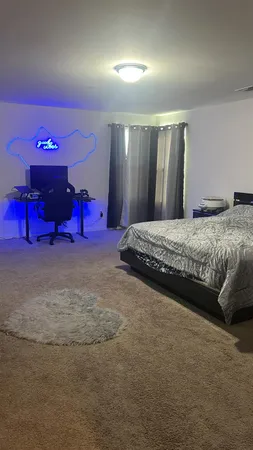 a bedroom with a bed and closet