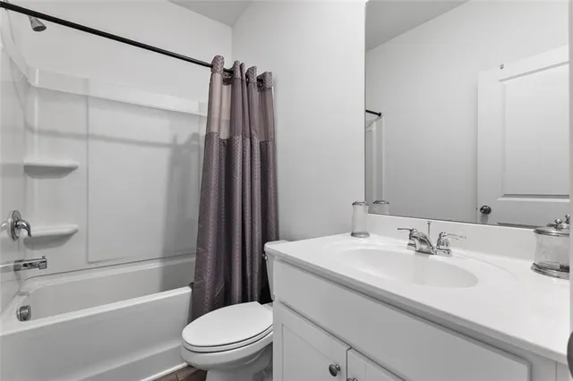 a view of a livingroom with workspace and a couch