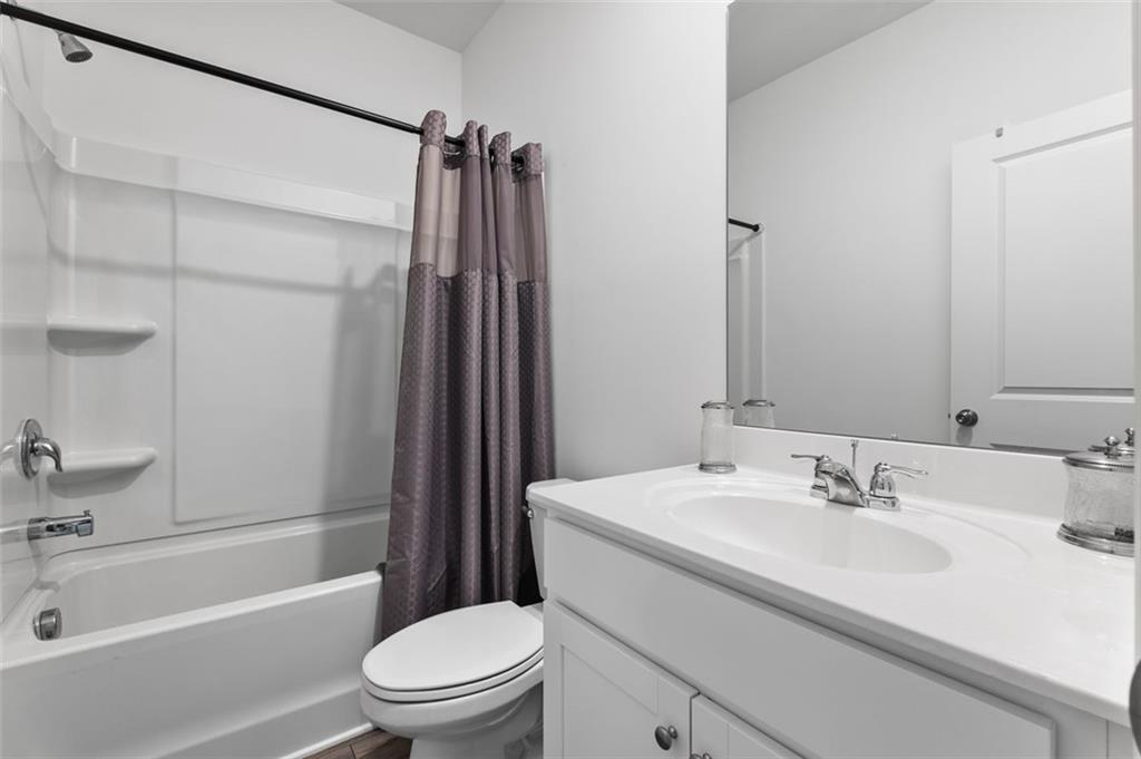 1182 Edwin Lane Sugar Hill, GA 30518 - Photo 24 of 32 a bathroom with a sink toilet and shower