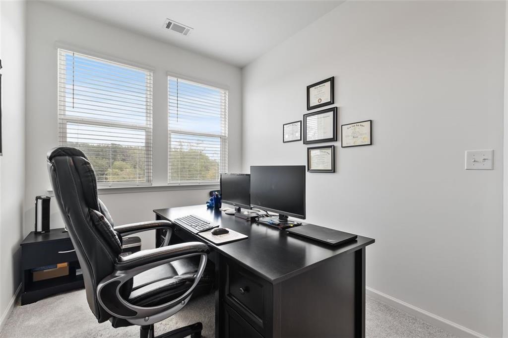 1182 Edwin Lane Sugar Hill, GA 30518 - Photo 26 of 32 a view of a workspace with furniture and a window