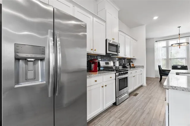 a living room with furniture fireplace and window