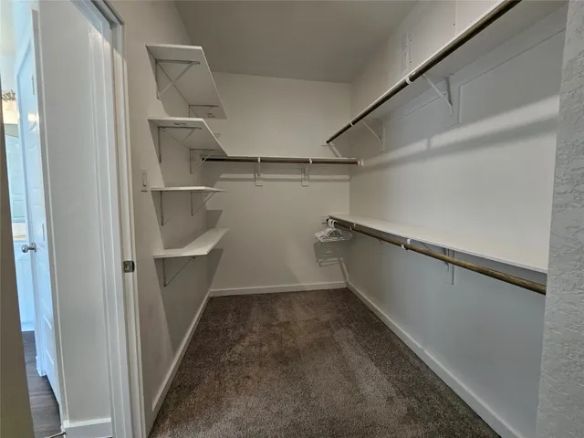 a view of storage and utility room with empty racks