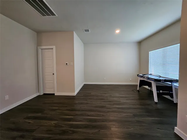 a view of room with hardwood floor