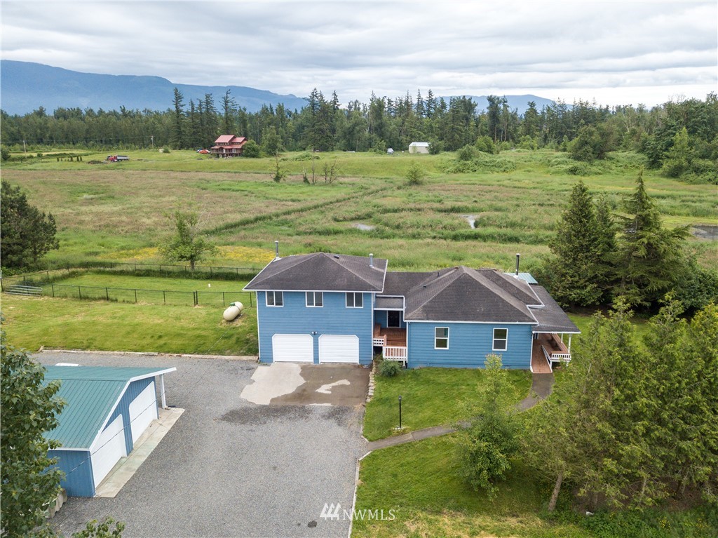 2419 East Badger Road Everson, WA 98247 - Photo 1 of 34 a aerial view of a house with a yard and a fountain