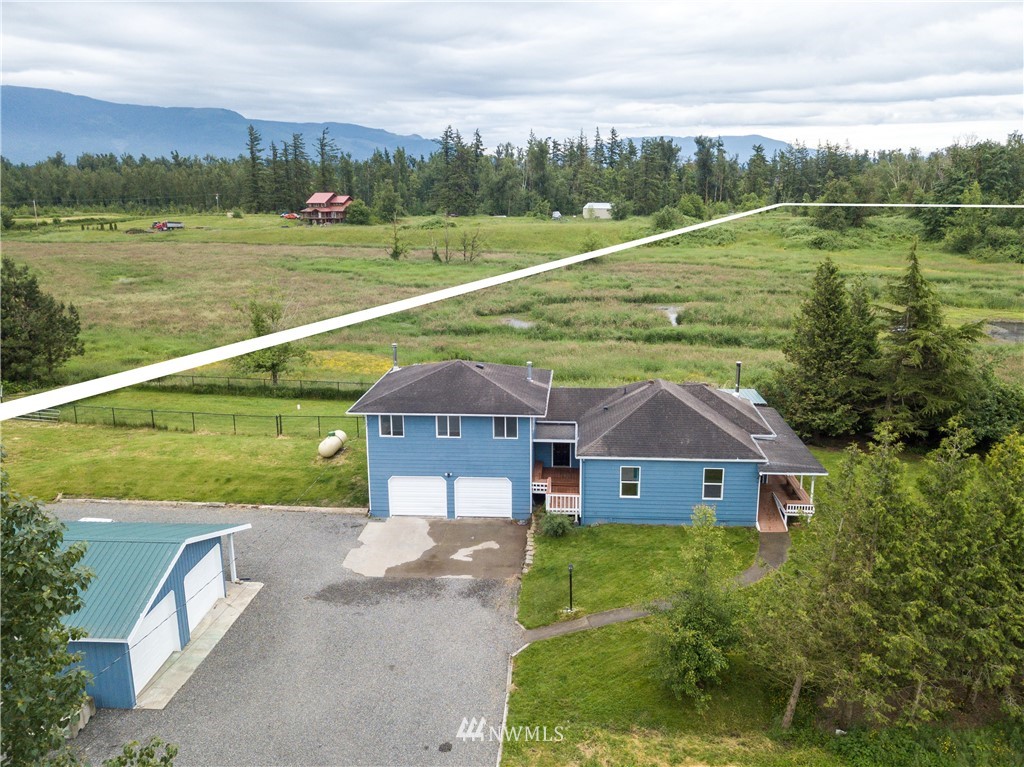 2419 East Badger Road Everson, WA 98247 - Photo 2 of 34 a aerial view of a house with a yard