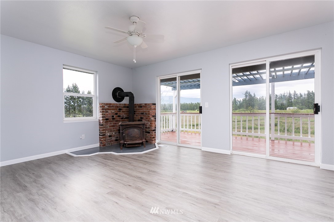 2419 East Badger Road Everson, WA 98247 - Photo 12 of 34 a living room with furniture and a large window