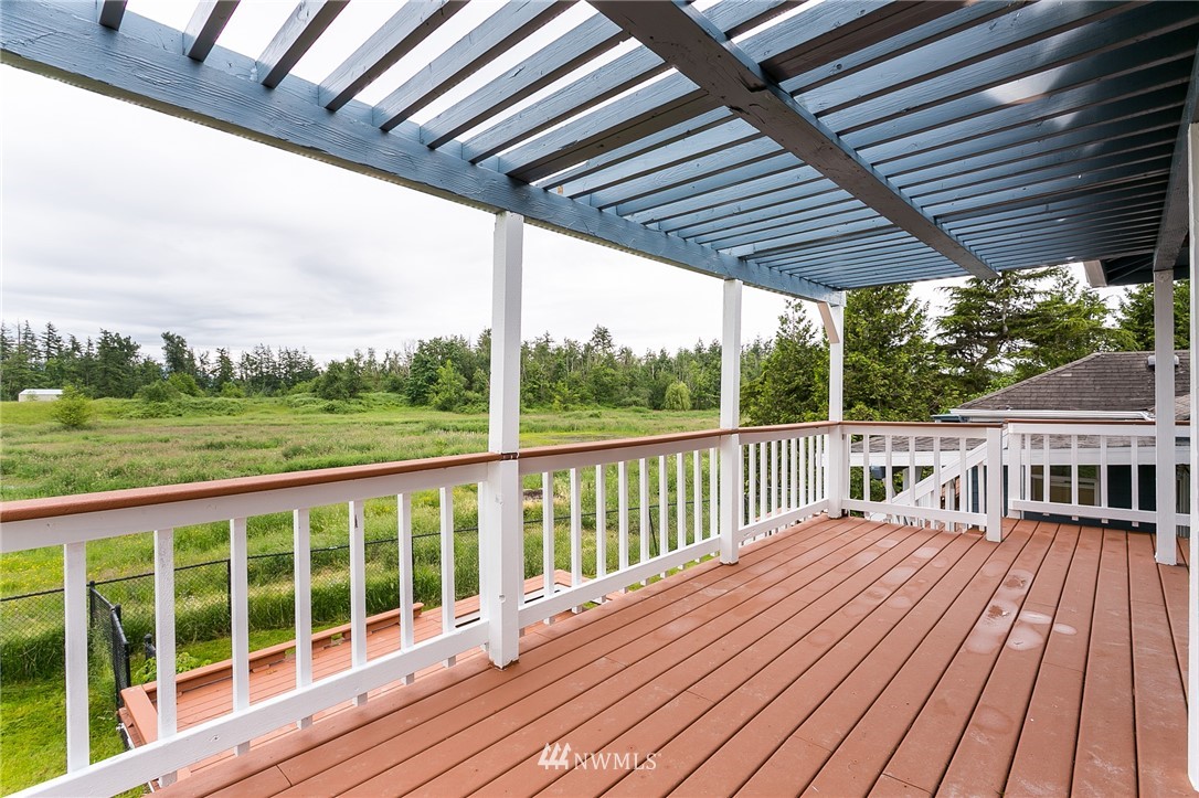 2419 East Badger Road Everson, WA 98247 - Photo 24 of 34 a view of balcony with wooden floor and fence