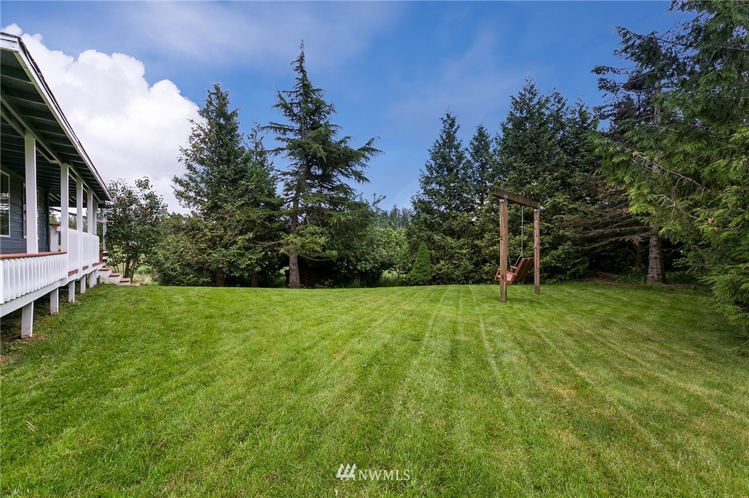 2419 East Badger Road Everson, WA 98247 - Photo 26 of 34 a view of a field of grass and trees