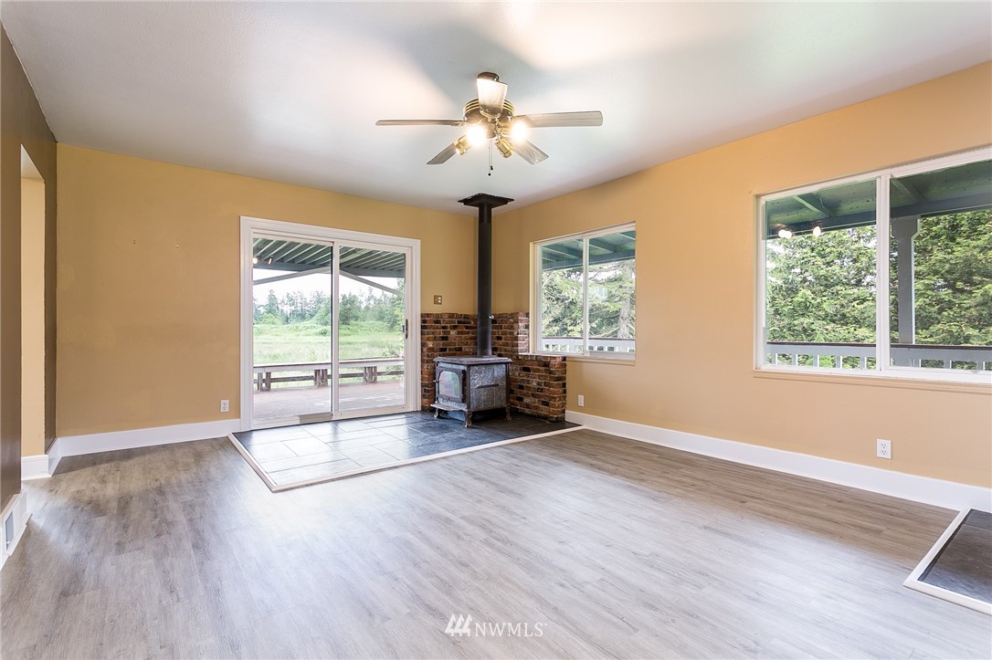 2419 East Badger Road Everson, WA 98247 - Photo 10 of 34 a view of an empty room with wooden floor and a window