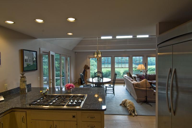 2087 Cold Spring Road Williamstown, MA 01267 - Photo 4 of 20 a kitchen with stainless steel appliances granite countertop a stove refrigerator and couches