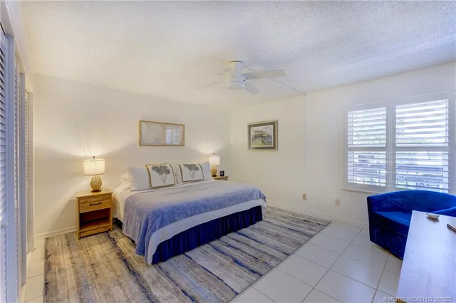 a bedroom with a bed and a table