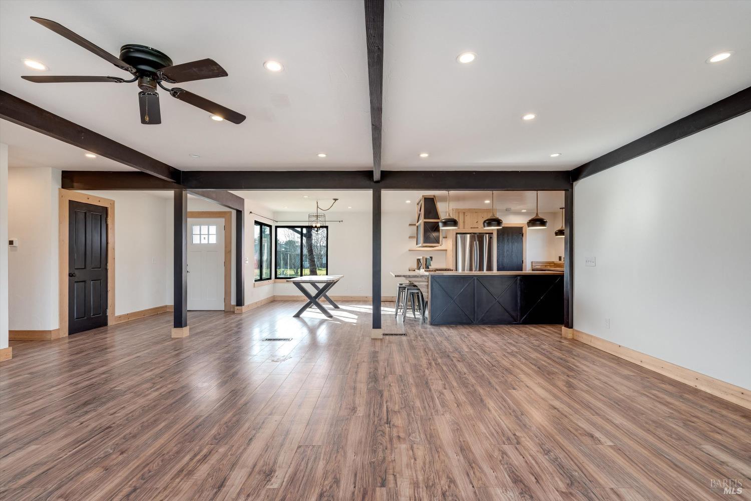 985 Gumview Road Windsor, CA 95492 - Photo 18 of 48 a view of an empty room with window and wooden floor