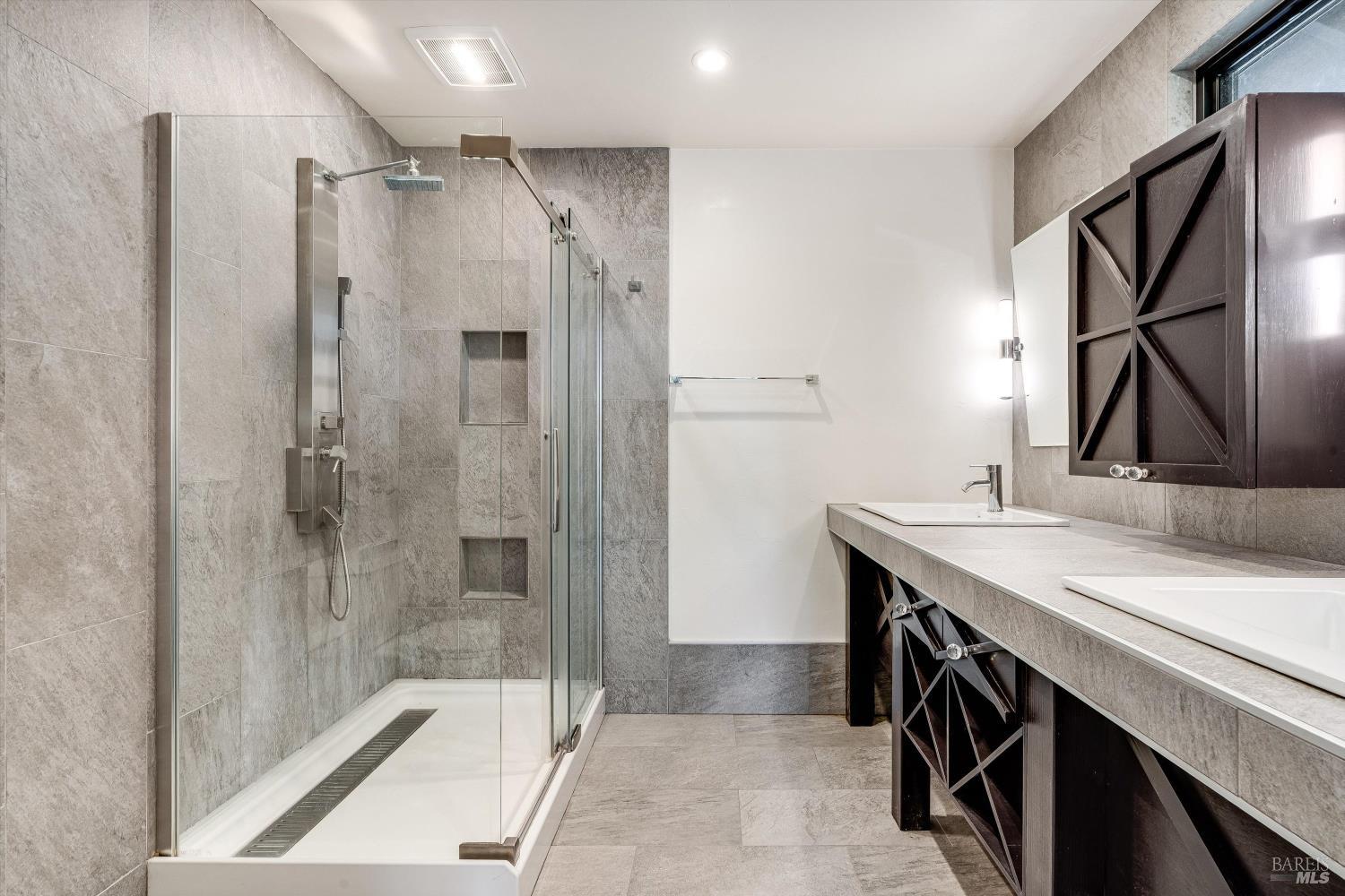 985 Gumview Road Windsor, CA 95492 - Photo 26 of 48 a bathroom with a sink a mirror and a shower