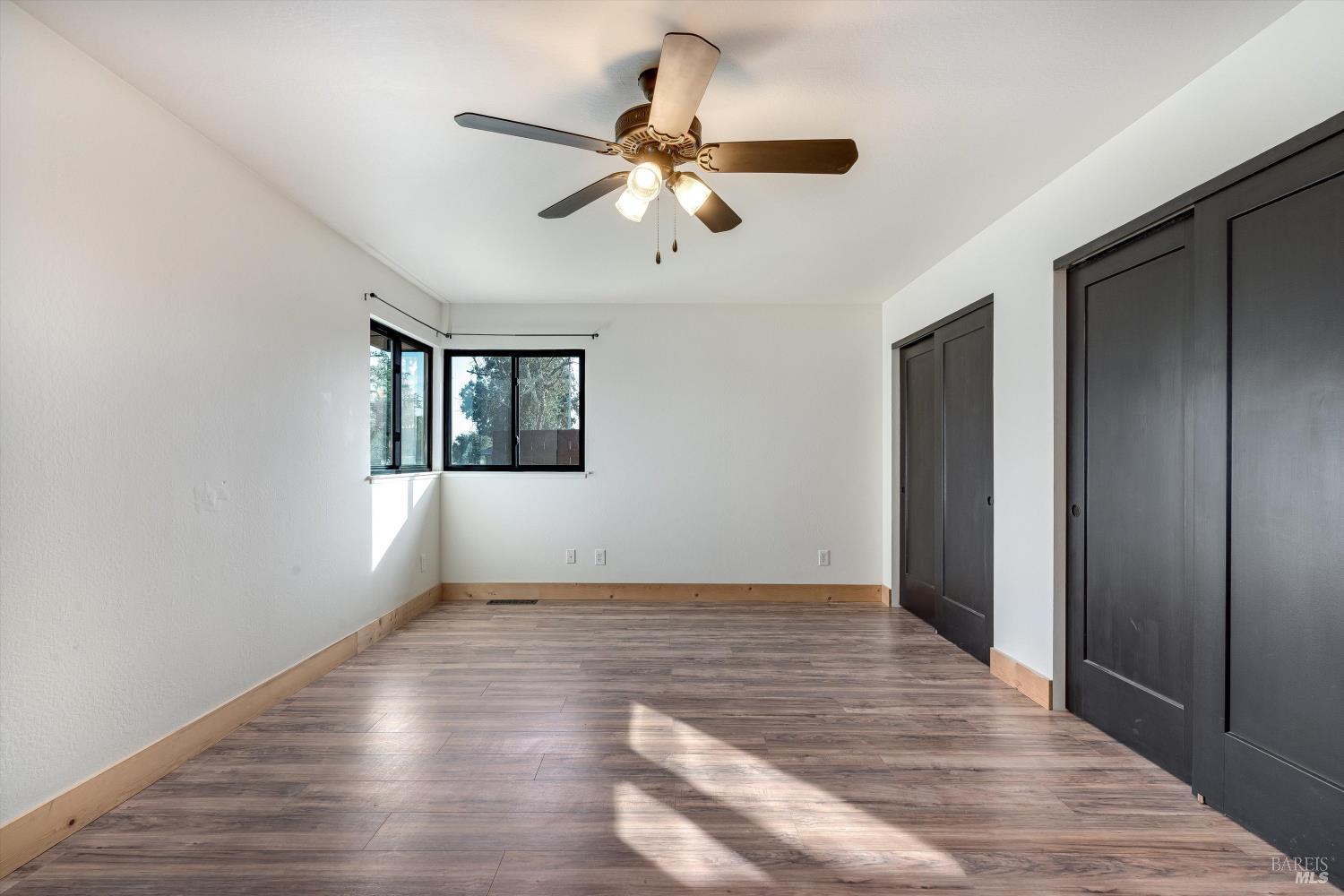 985 Gumview Road Windsor, CA 95492 - Photo 28 of 48 a view of an empty room with wooden floor and a window