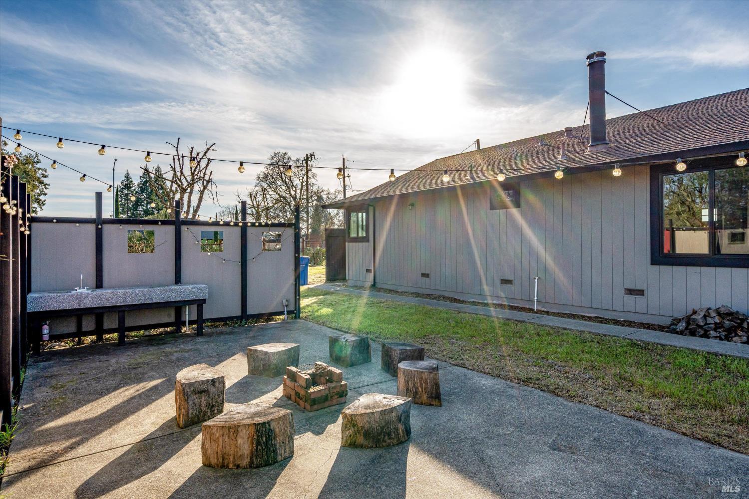 985 Gumview Road Windsor, CA 95492 - Photo 42 of 48 a backyard of a house with yard fire pit and outdoor seating