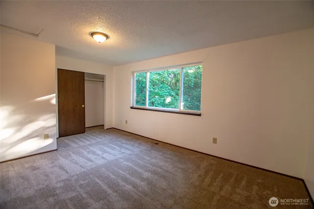 a room with stairs and wooden floor