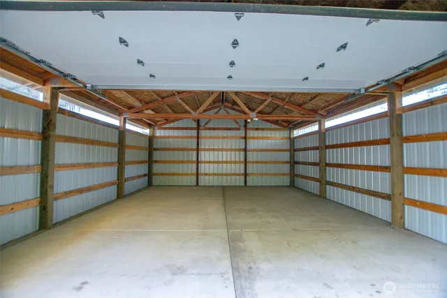 a view of a backyard with wooden fence
