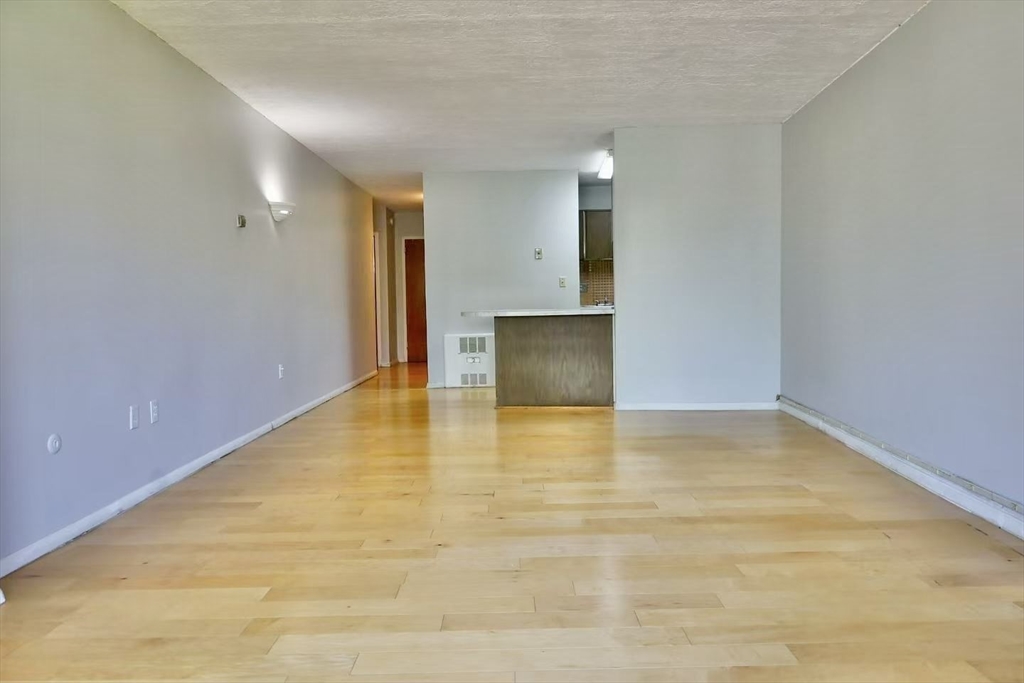200 Swanton Street, Unit 237 Winchester, MA 01890 - Photo 5 of 14 a view of an empty room and window