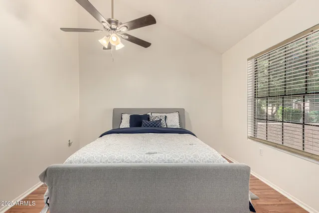 a bedroom with a bed and window