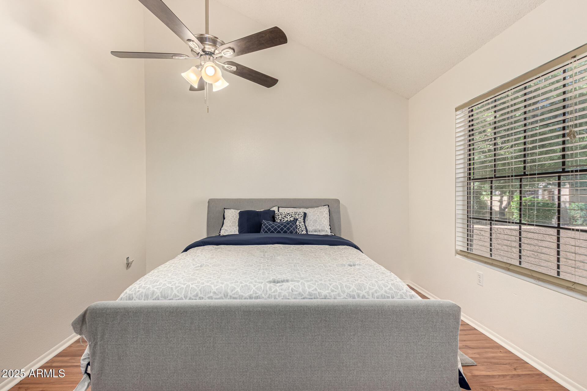 602 North May, Unit 49 Mesa, AZ 85201 - Photo 19 of 32 a bedroom with a bed and window